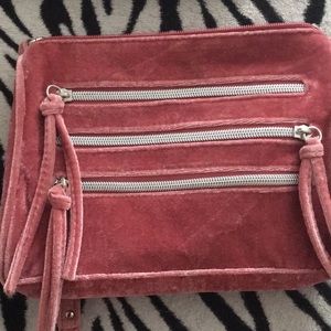 A pink bag with chains
